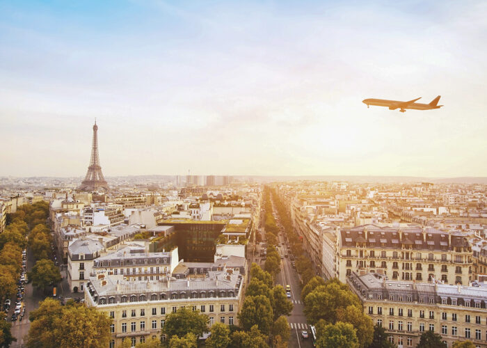 airplane flying over eiffel tower in paris france