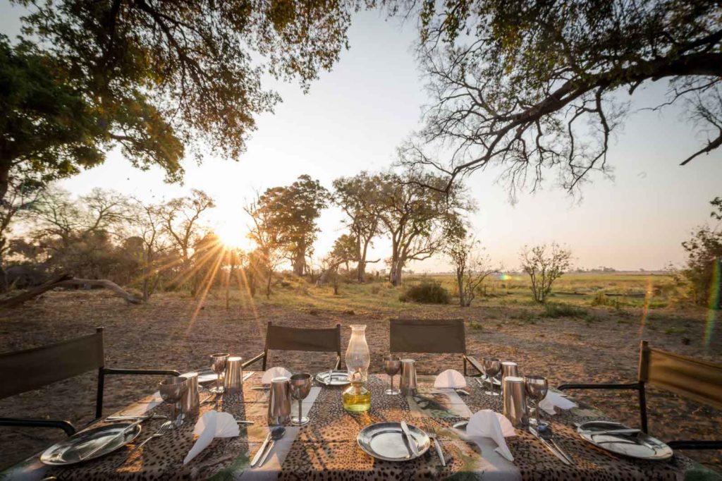 Dining table laid out in the wilderness on an Afrika Ecco Mobile Safari