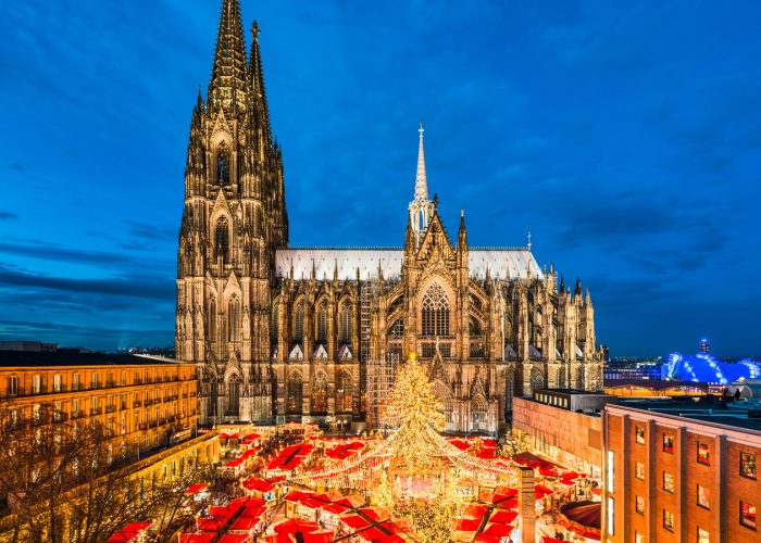 german christmas market aerial shot with stalls and church